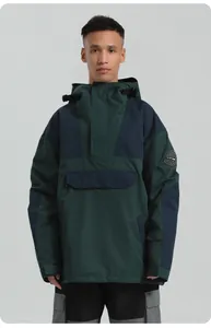Detail of waterproof dark green and navy anorak jacket with front pocket and hood
