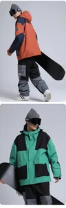 Detail of waterproof GSOU SNOW ski suit with contrast panels and functional pockets