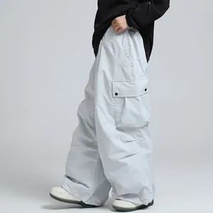 Waterproof loose fit winter ski pants with functional cargo pockets for men and women