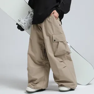 Loose khaki professional ski pants with waterproof fabric and utility cargo pockets