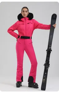 Detail of pink ski suit with quilted texture, faux fur collar and adjustable waist belt