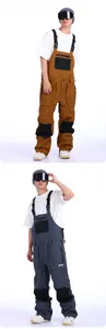 Waterproof men's bib ski pants with adjustable straps and reinforced knee pads