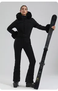 Detail of slim-fit black one-piece ski suit with luxury faux fur collar and windproof hood