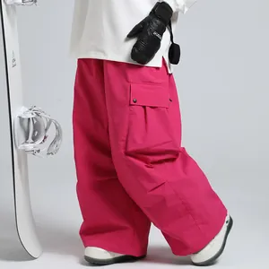 Waterproof professional loose fit pink ski pants with side cargo pocket for winter outdoors