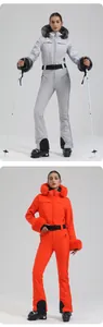Detail of one-piece ski suit with luxury faux fur hood and adjustable waist belt