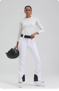 Detail of white slim fit ski pants with black buckle belt and reinforced inner ankle pads