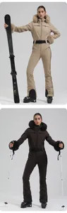 Detail view of slim-fit women's ski suit featuring faux fur hood and adjustable waist belt