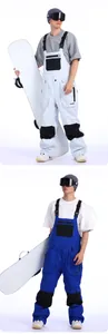 Detail view of adjustable suspenders and durable fabric on GSOU SNOW ski pants