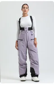 Detail view of light purple waterproof ski bib pants with black adjustable suspenders