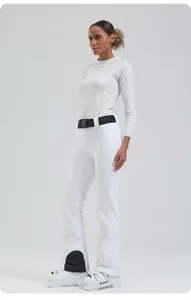 Detail of white slim-fit ski pants featuring black waist belt and reinforced leg patches