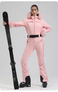 Pink one-piece ski suit detail with fur hood, black waist belt and sleek side texture