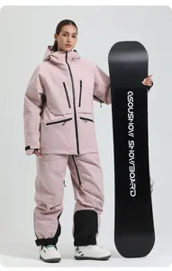 Women's pink hooded ski jacket and matching pants with waterproof black zippers