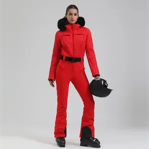 Women's bright red one-piece ski suit with black fur hood and belt for alpine skiing