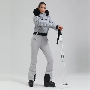Women's light grey ski suit set with faux fur hood and quilted texture for winter