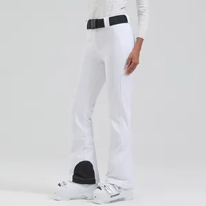 Slim-fit white high-waist women's ski pants with black belt and flared waterproof hem