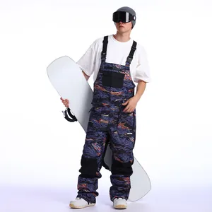 Men's waterproof ski bib pants with blue abstract print and adjustable black straps