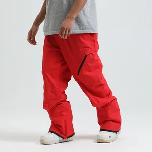 Vibrant red waterproof ski pants for men and women featuring a zippered cargo leg pocket