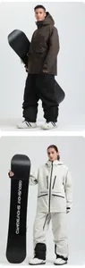 Waterproof ski jacket and pants set for men and women featuring insulated hooded design