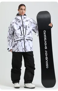 Detail of hooded marble print ski jacket with multiple zipper pockets and waterproof fabric