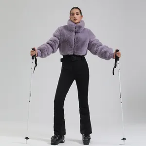 Women's winter purple faux fur ski jacket and black high-waisted pants outdoor set