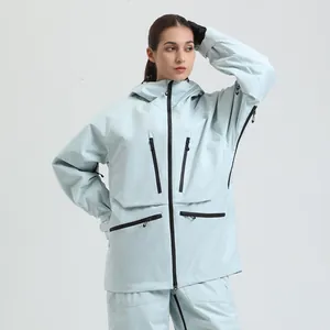 Waterproof women's ski suit with hooded jacket and pants in light mint green color