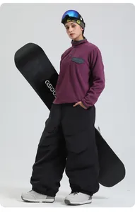 Outdoor winter ski set featuring purple fleece top and black windproof pants with accessories