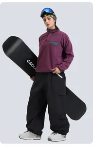 Detail of loose fit cargo snow pants with side pockets for winter outdoor skiing