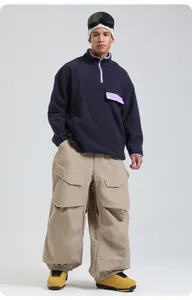 Winter fleece half-zip jacket and beige cargo pants with goggles for outdoor skiing