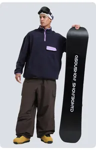 Detail of loose-fit cargo ski pants with multi-pockets and waterproof outdoor snowboard gear