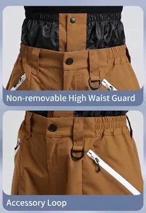 Detail of waterproof ski pants featuring non-detachable heightened waist and buckle