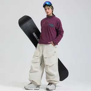 Winter snowboarding outfit with purple fleece top and off-white windproof cargo pants