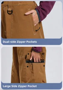 Detailed view of brown waterproof ski pants with D-ring, zipper pockets and contrast stitching