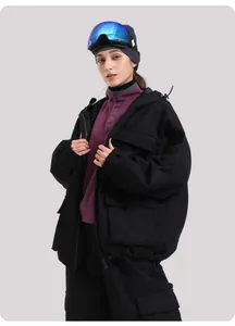 Detail of waterproof oversized black hooded ski jacket with multiple cargo pockets