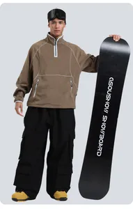 Detail of loose corduroy ski pants with multi-pocket design and waterproof fabric