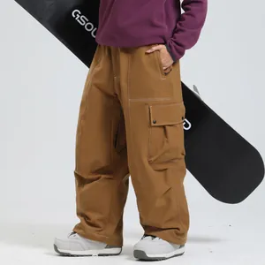 Pantalon de ski d'hiver marron ample avec surpiqûres blanches et poches cargo de sport