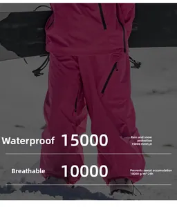 Waterproof pink ski suit detail showing 15000mm water resistance and 10000g breathability