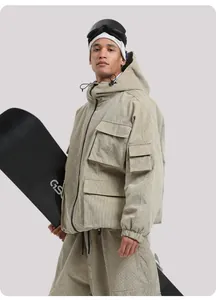 Detailed view of beige corduroy ski jacket featuring utility pockets and durable texture