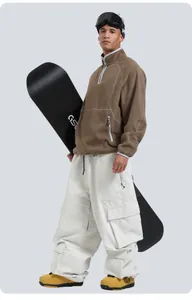 Winter corduroy ski pants detail showing cargo pockets and professional outdoor styling