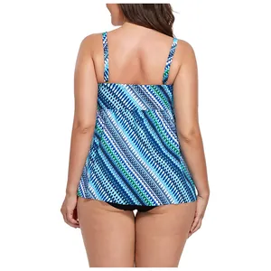 Back view of a plus size tankini top with green geometric print and thin shoulder straps