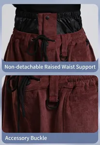 Detail of high waist protector and drawstring on burgundy corduroy ski pants