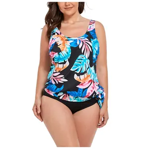 Detailed view of plus size tankini with tropical leaf print and side tie-up detail