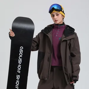 Waterproof men's brown ski jacket with snow goggles and a snowboard for outdoor sports