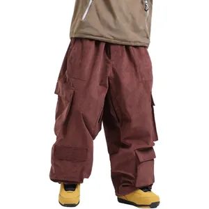 Loose fit corduroy ski pants with cargo pockets in deep burgundy waterproof fabric