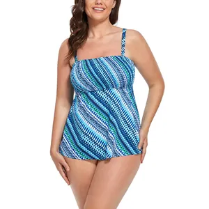 Women's blue geometric print tankini top with thin straps and slimming A-line cut