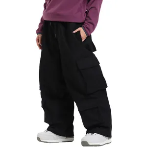 Waterproof loose corduroy ski pants with multi-pocket cargo design in black color