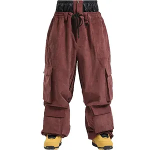 Waterproof corduroy ski pants with multi-pocket cargo design in dark reddish brown