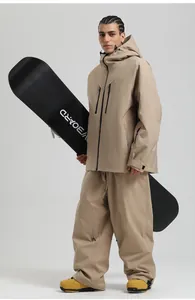 Detail of khaki ski jacket and pants set showing waterproof zippers and windproof hood