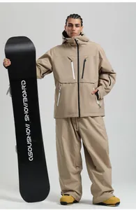 Full view of loose fit waterproof ski jacket and pants set in beige with multiple zip pockets