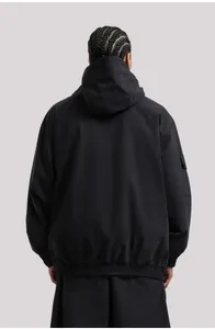 Rear view of a black hooded ski jacket with elastic hem and cargo sleeve pocket