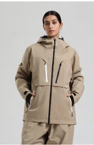 Detail of khaki ski jacket featuring contrast waterproof zippers and windproof cuffs